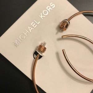 Michael Kors Rose gold hoop earrings.